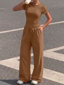 Detailed view of the brown ribbed short sleeve top and matching casual wide leg pants set.