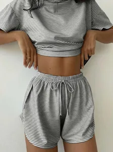 Casual striped knit pajama set featuring a short sleeve top and drawstring shorts for women.