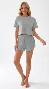 Detailed view of women's black and white striped knit pajama set featuring short sleeves and shorts.