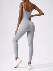 Grey ribbed backless yoga jumpsuit detail, showing stretch fit and breathable athletic fabric.