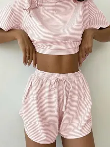 Pink striped knit loungewear set featuring a short sleeve top and comfortable shorts for women.