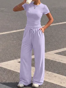 Detailed view of the casual lavender two-piece set featuring a short sleeve top and wide leg pants.