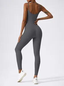 Dark grey ribbed backless yoga jumpsuit, activewear detail view showcasing stretch and fit.