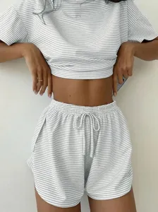 Striped knit loungewear set featuring a short sleeve top and drawstring shorts for women.