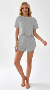 Detail showcase of a chic black and white striped knit pajama set with comfy shorts.