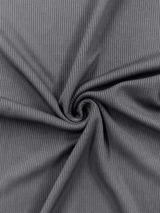 Detailed view of dark gray ribbed fabric texture for casual yoga sports jumpsuit clothing.