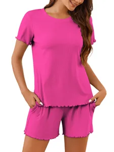 Close-up view of ribbed knit short sleeve top and shorts with pockets and lettuce trim.