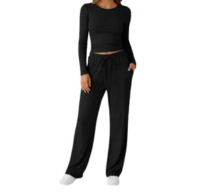 Detail shot of the black long sleeve top and loose lounge pants set, soft ribbed fabric.