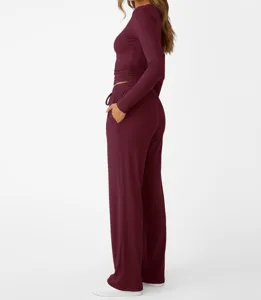 Detail view of women's solid color long sleeve lounge set with wide leg pants in burgundy.
