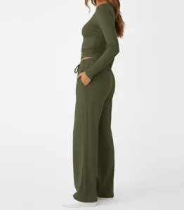 Detailed view of solid olive green long sleeve top and lounge pants set, soft ribbed fabric.
