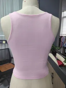 Detailed back view of the light pink ribbed crop tank top, solid knit vest top for women.