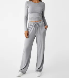 Details of grey solid round neck long sleeve crop top and loose sweatpants lounge set.