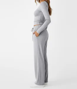 Grey lounge set for women, featuring a long sleeve crop top and comfortable sweatpants.