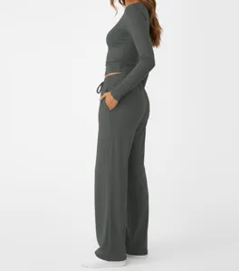 Side view detail of dark grey long sleeve top and matching loose trousers set for daily wear.