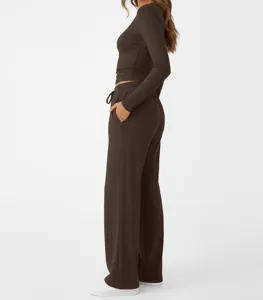Women's solid long sleeve crewneck top and lounge pants casual athletic set in brown.