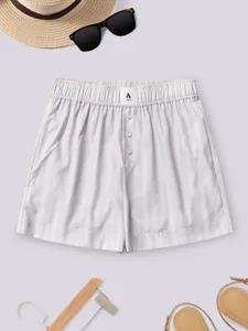 Summer casual striped women shorts detail view featuring elastic high waist and buttons.