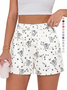 Detailed view of women's high-waisted boxer shorts featuring cute angel and heart doodle prints.