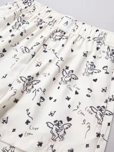 Detailed view of women's casual lounge shorts with cute cherub doodle print and elastic waist.