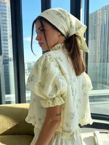Light yellow floral puff sleeve blouse with matching headscarf, casual two-piece chic set.