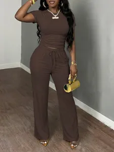 Brown two piece set for women featuring short sleeve top and wide leg casual pants.