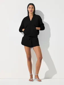 Black zip-up hoodie and shorts sportswear set detail view, casual everyday athletic wear.