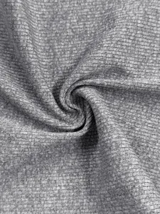 Close-up detail shot of grey ribbed knit fabric featuring soft texture and fine vertical lines.