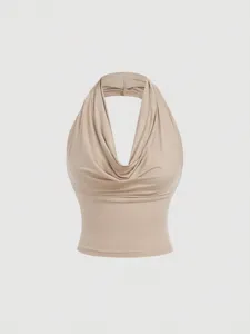 Detailed view of the elegant beige cowl neck halter top, showcasing soft fabric and draping.