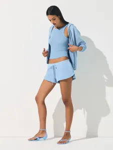Detailed view of light blue casual zip hoodie tank top and shorts set, comfortable fabric fit.