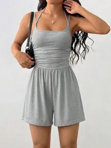 Close-up detail of the grey halter romper, featuring ribbed fabric and casual summer wear design.
