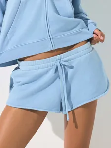 Detail shot of light blue casual hoodie and shorts set featuring zip closure and drawstrings.