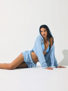 Detailed view of women casual blue crop hoodie and matching shorts set, stylish activewear outfit.