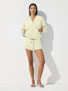 Casual short zip hoodie and matching shorts set for women, stylish and comfortable sportswear.