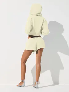 Beige cropped hoodie and shorts lounge set, back view detail showing casual comfort style.