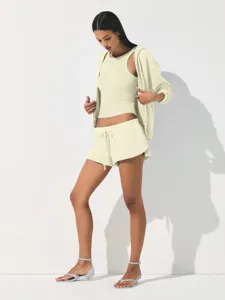 Casual sporty 3-piece set detail view featuring zip hoodie, crop tank top, and comfy shorts.