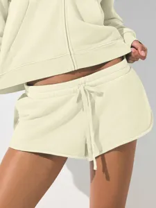 Casual women crop zip hoodie and sweat shorts set in solid cream, perfect for daily wear.