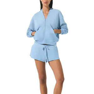 Blue athletic zip-up jacket and shorts matching set, comfortable casual wear for women.