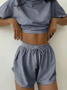 Detail shot of a women's blue and white striped short sleeve lounge set showing fabric and fit.