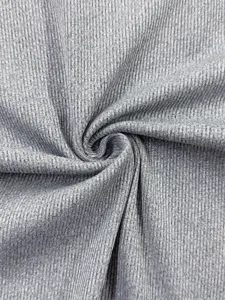 Close up view of premium grey ribbed stretch fabric texture detail for apparel manufacturing