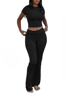 Detailed look at the black two-piece crop top and flare pants set, showing sleek design.