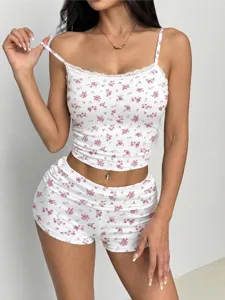 Detail shot showing floral camisole top and shorts set fabric, lace trim and floral print.