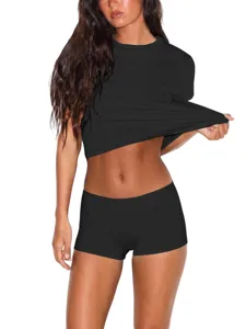 Detail view of a slim-fit black short-sleeve crop T-shirt and shorts set, casual style.