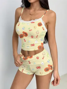Close-up detail shot of the fruit print camisole and matching shorts set with lace trim.