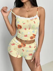Detailed view of women's fruit print camisole and shorts set with delicate lace trim.