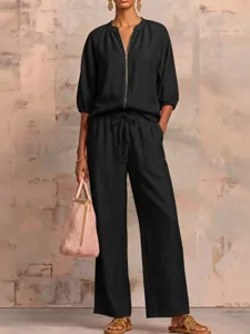 Casual black two piece pants set with zip top and wide leg trousers for women summer style.