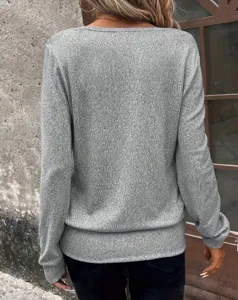 Detailed view of the casual grey long sleeve square neck top showing textured fabric design.
