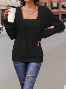 Detail view of a stylish black square neck long sleeve faux two piece loose T-shirt.