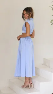 Light blue mock neck sleeveless crop top and midi skirt set, stylish summer chic outfit.