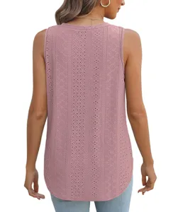 Back view detail of women pink eyelet sleeveless tank top with intricate pattern texture.