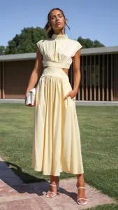 Chic summer yellow sleeveless high neck cutout maxi dress for women street fashion outfit.