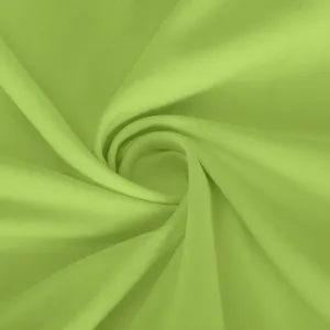 Close up of light green stretch fabric detail, showing smooth texture and spiral swirl.